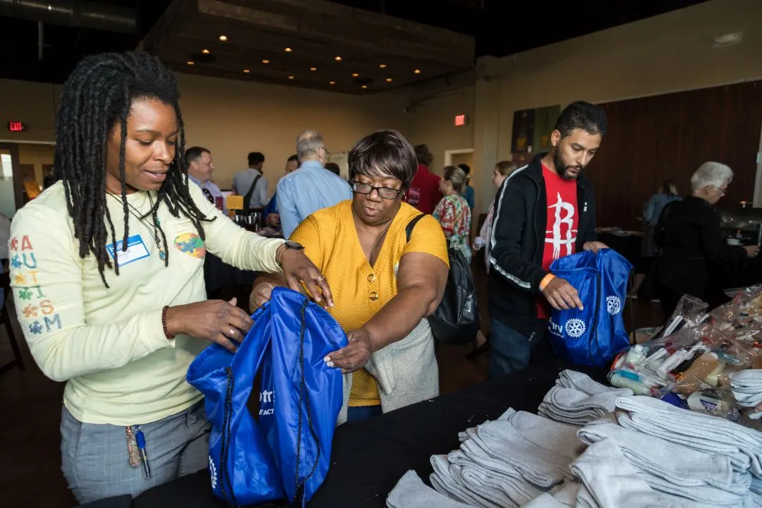 Rotary club members serving their community