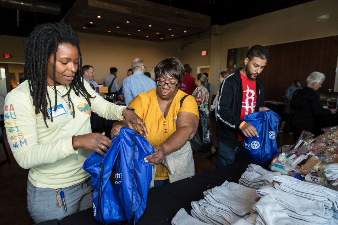 Rotary club members serving their community